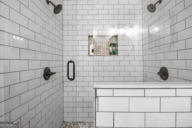 bathroom featuring a shower with shower door