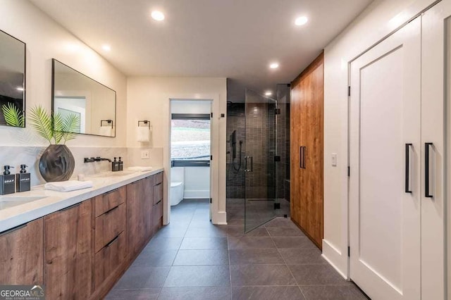 bathroom with vanity, toilet, and walk in shower