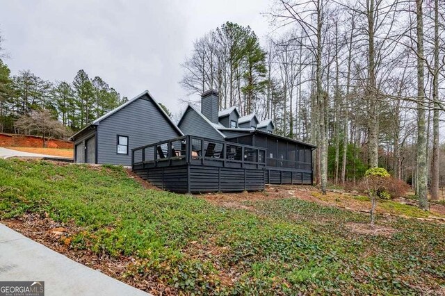 back of house with a sunroom