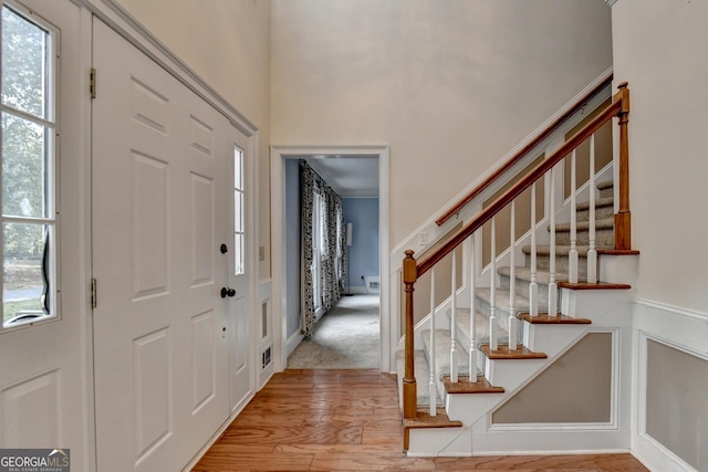 entryway with plenty of natural light and wood-type flooring