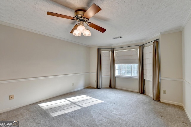 unfurnished bedroom featuring a textured ceiling, ceiling fan, light colored carpet, and crown molding