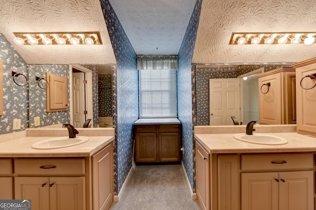 bathroom featuring vanity and a textured ceiling