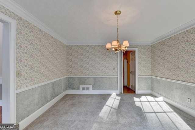 unfurnished dining area featuring carpet floors, crown molding, and an inviting chandelier