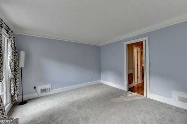 carpeted spare room with ornamental molding