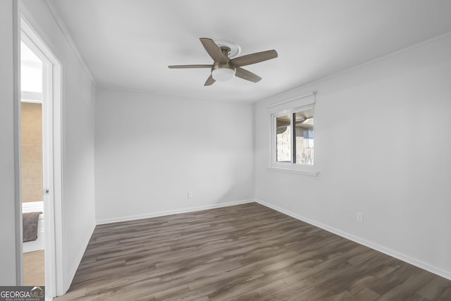 unfurnished room featuring ceiling fan, dark hardwood / wood-style floors, and ornamental molding