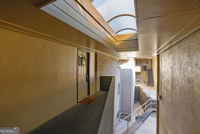 corridor featuring hardwood / wood-style floors