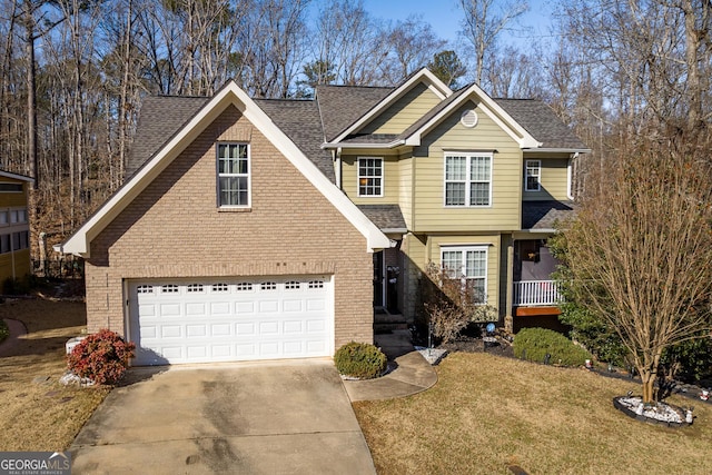 view of front of home with a garage and a front lawn