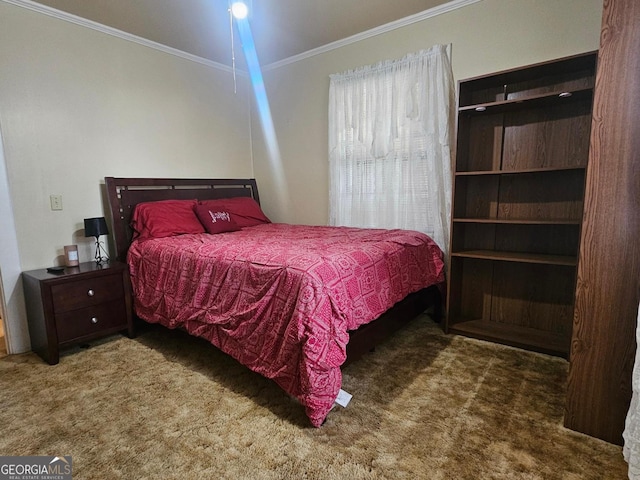 bedroom with ornamental molding and dark carpet