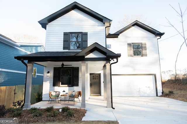 view of front of home featuring covered porch and a garage