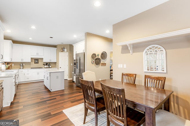 dining area featuring dark hardwood / wood-style flooring and sink