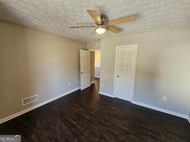 unfurnished bedroom featuring a textured ceiling, ceiling fan, and dark hardwood / wood-style floors