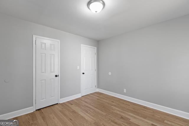 unfurnished bedroom with light hardwood / wood-style flooring