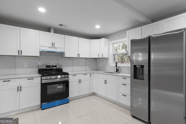 kitchen featuring sink, white cabinetry, tasteful backsplash, gas stove, and stainless steel fridge with ice dispenser