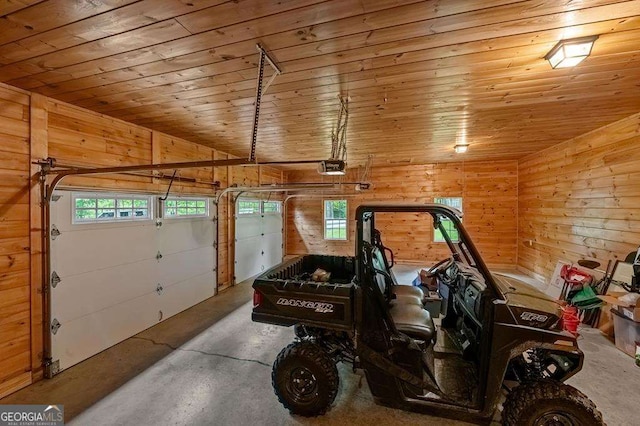 garage with wooden walls, wood ceiling, and a garage door opener