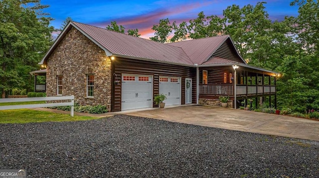 property exterior at dusk with a garage