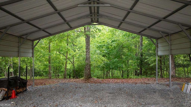 view of vehicle parking with a carport