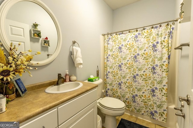 bathroom with tile patterned flooring, vanity, toilet, and a shower with curtain