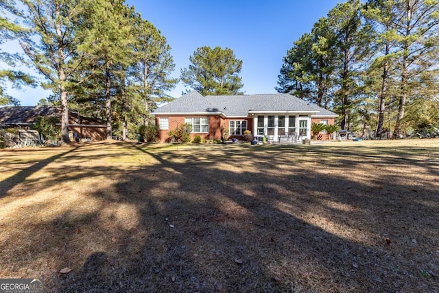 ranch-style house with a front yard