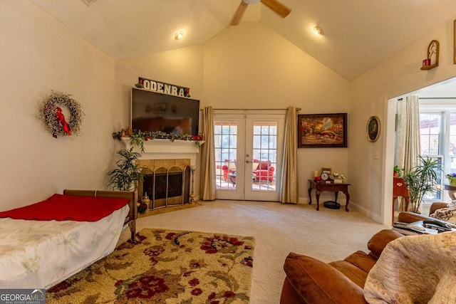 carpeted bedroom featuring access to outside, ceiling fan, french doors, and lofted ceiling