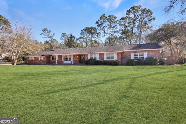 ranch-style home featuring a front yard