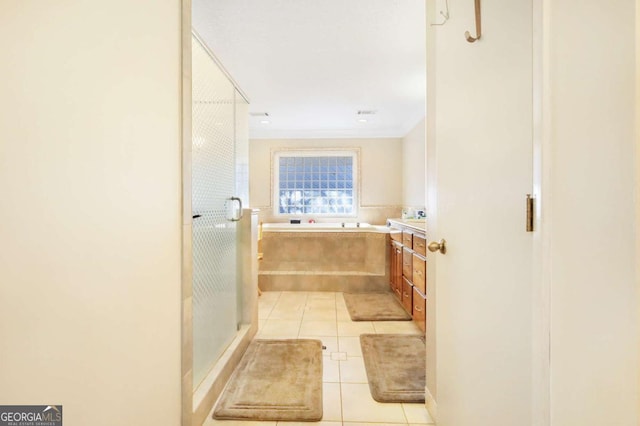 bathroom featuring tile patterned floors, vanity, and independent shower and bath