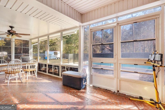 sunroom with a wealth of natural light and ceiling fan