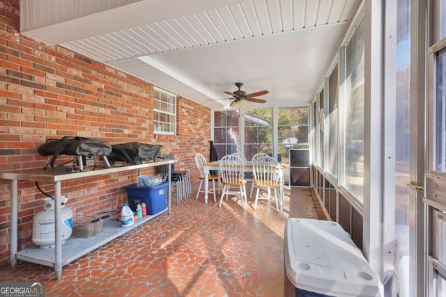 sunroom / solarium with ceiling fan