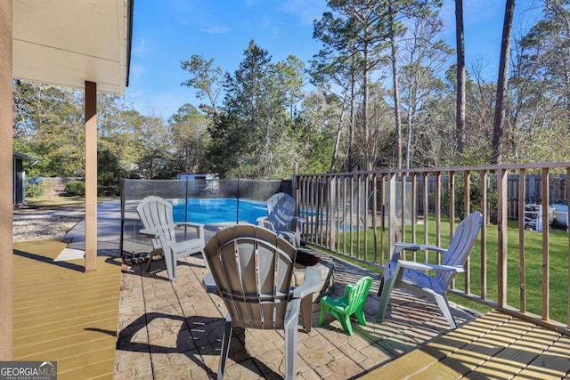 view of patio / terrace featuring a fenced in pool