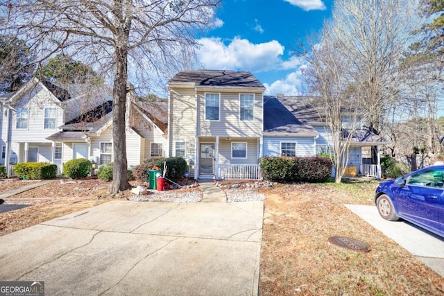 view of property featuring covered porch