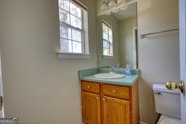 bathroom with vanity and toilet