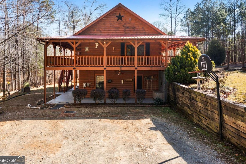 back of property featuring a patio area