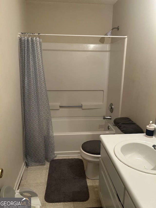 full bathroom with toilet, vanity, and shower / bath combination with curtain