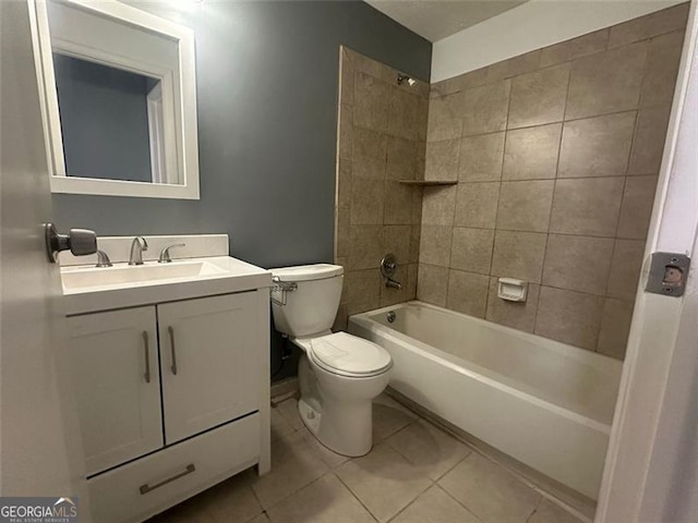 full bathroom with tile patterned floors, vanity, toilet, and tiled shower / bath