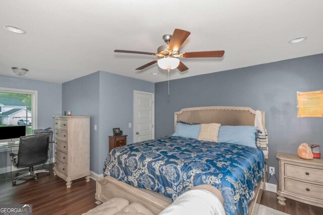 bedroom featuring ceiling fan and dark hardwood / wood-style flooring