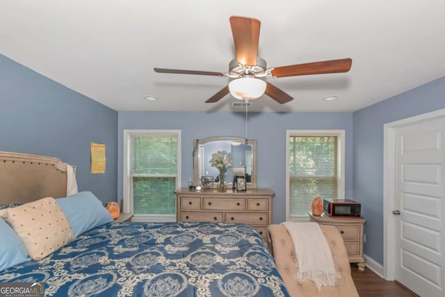 bedroom with ceiling fan and wood-type flooring