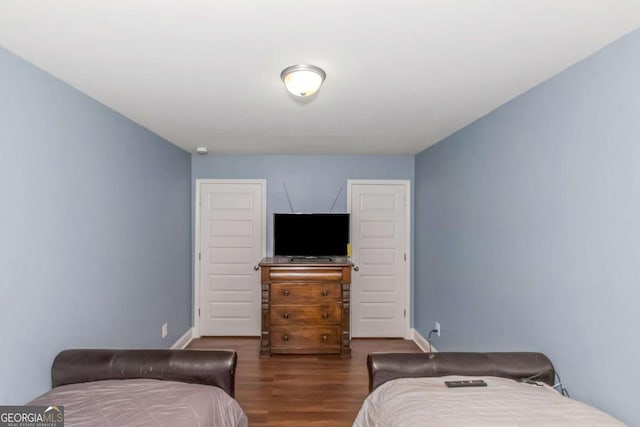 bedroom featuring dark hardwood / wood-style flooring