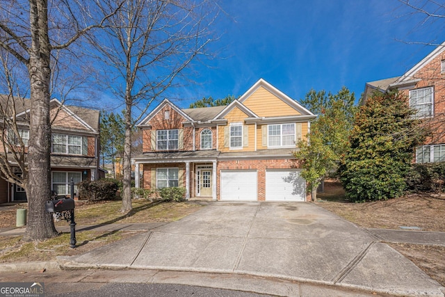 view of front of home with a garage, concrete driveway, and brick siding