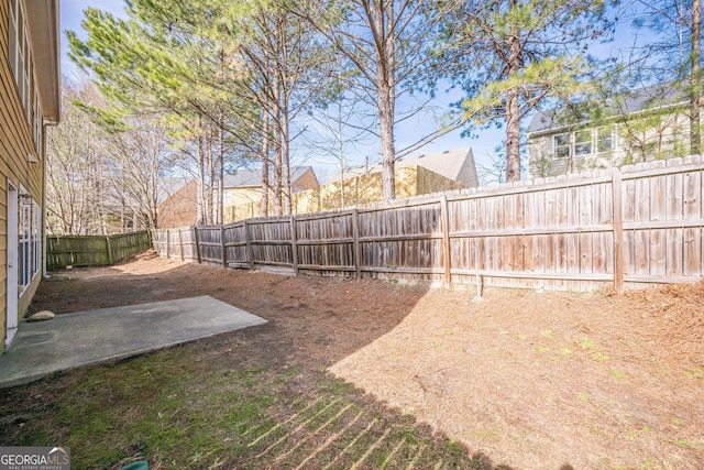 view of yard with a patio and a fenced backyard