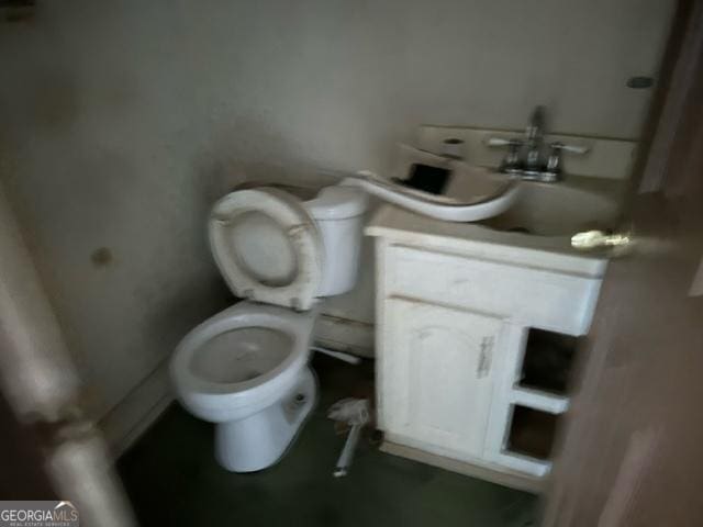 bathroom with vanity and toilet