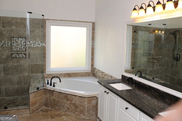 bathroom with vanity and separate shower and tub