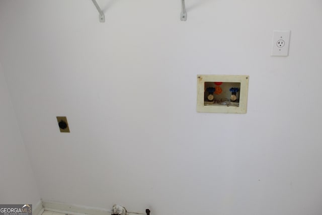 clothes washing area with hookup for a washing machine and electric dryer hookup