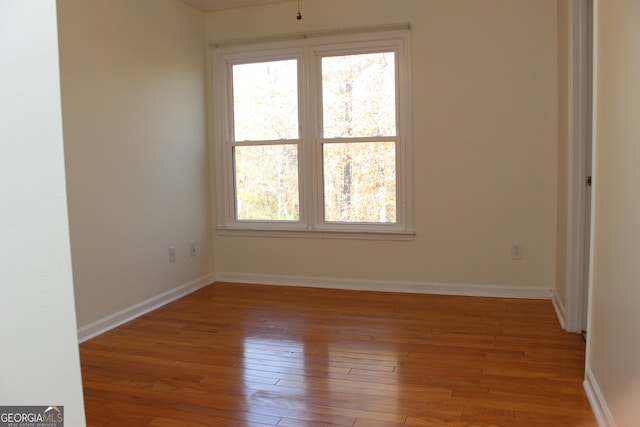 empty room with light hardwood / wood-style floors