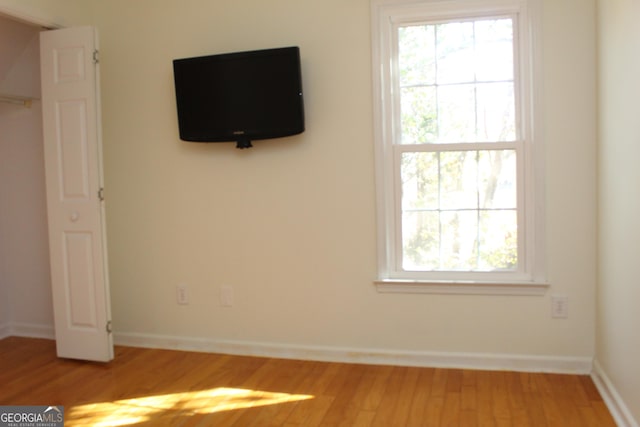 unfurnished bedroom featuring hardwood / wood-style floors