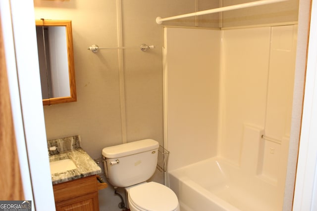 full bathroom with shower / tub combination, vanity, and toilet