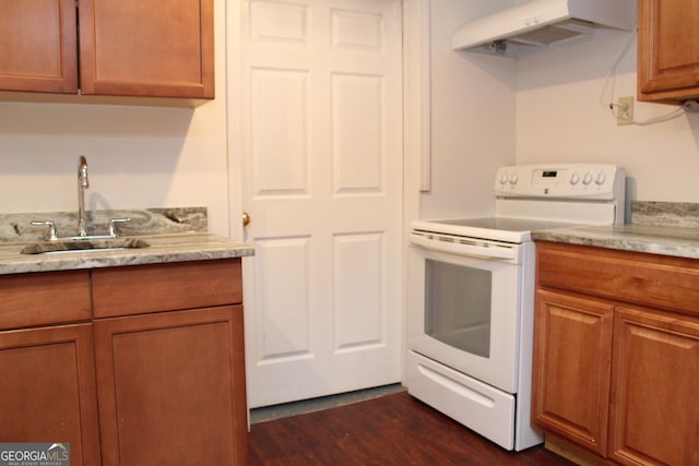 kitchen featuring extractor fan, dark hardwood / wood-style flooring, white range with electric stovetop, and sink