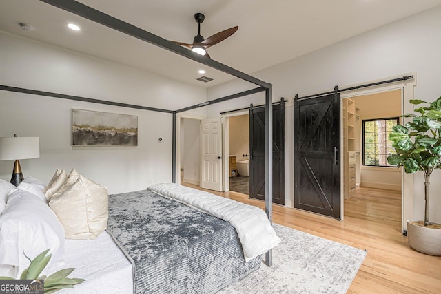 bedroom featuring wood-type flooring and ceiling fan