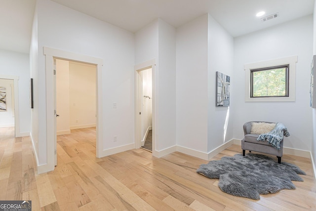 bathroom with a shower with door