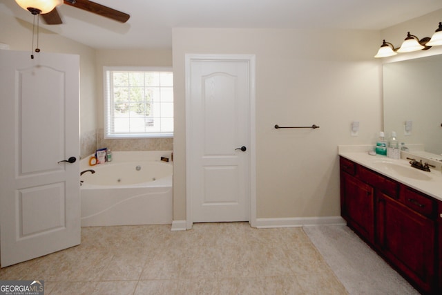 bathroom with a washtub, vanity, ceiling fan, and tile patterned flooring