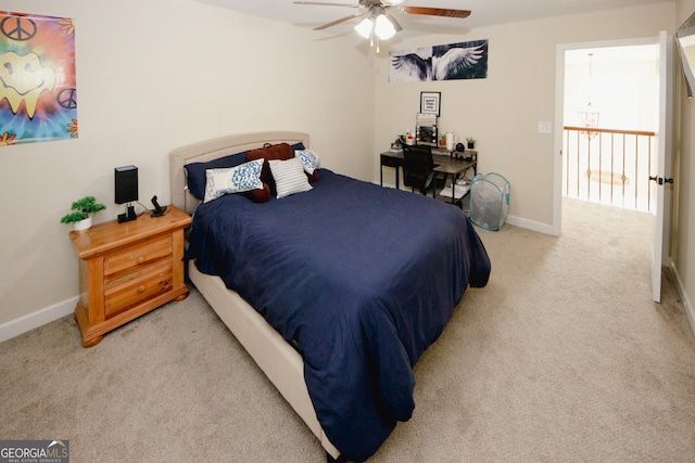 bedroom featuring ceiling fan and light carpet