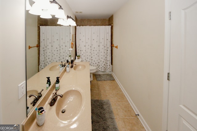 bathroom featuring curtained shower, tile patterned flooring, vanity, and toilet